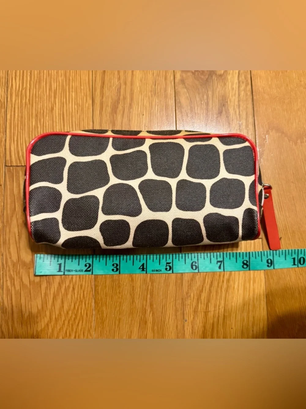 Kate Spade New York cosmetic bag or pencil case featuring a signature giraffe-